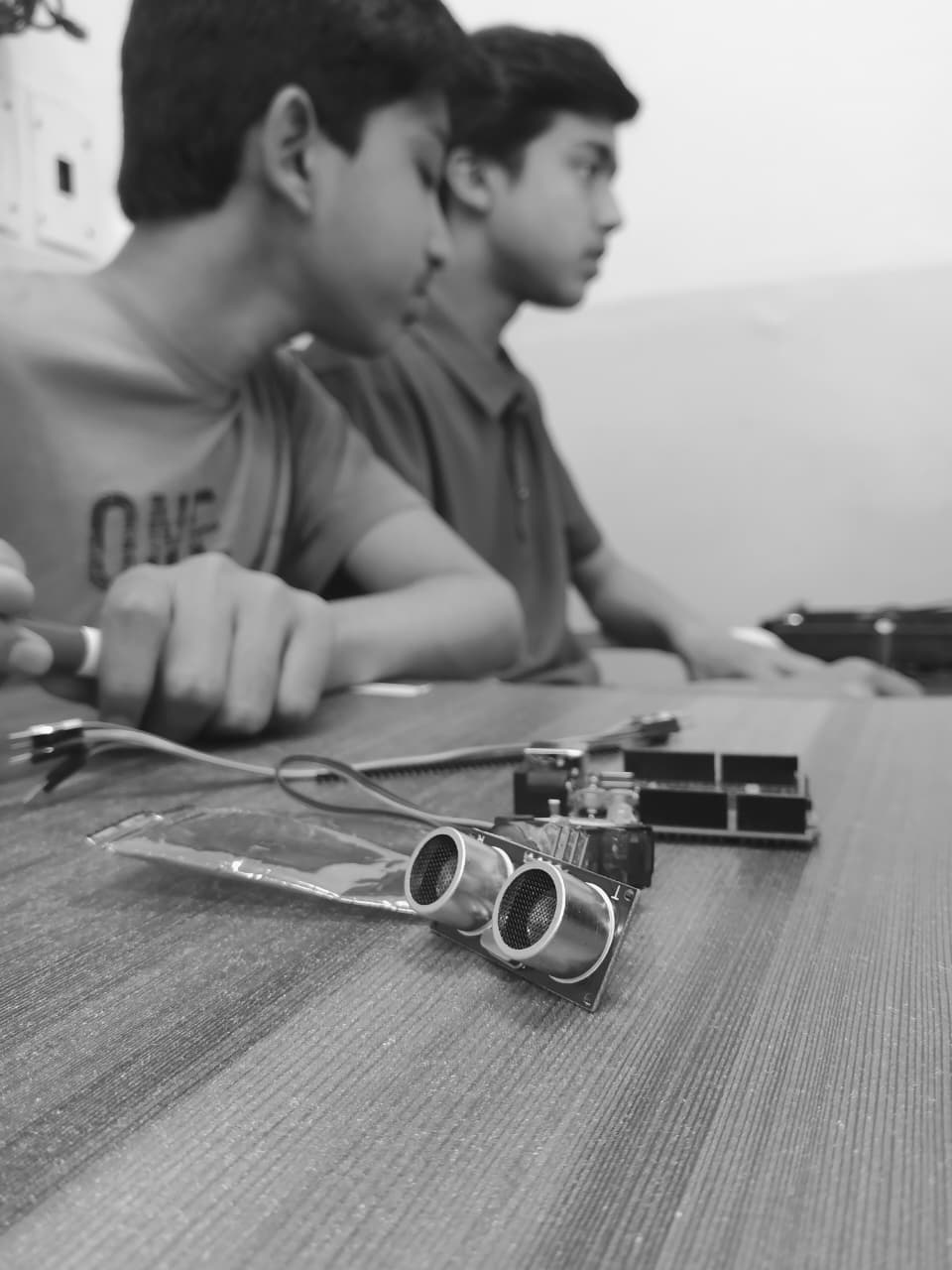 Students assembling a robot chassis